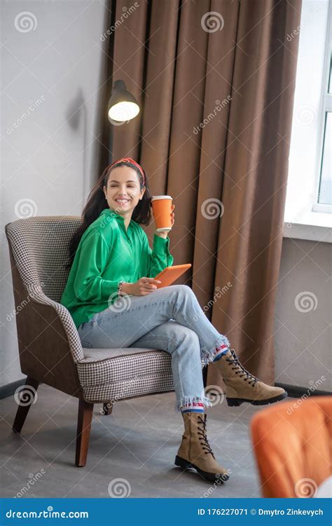 Pretty Woman Sitting In A Chair Cross Legged Stock Image Image Of
