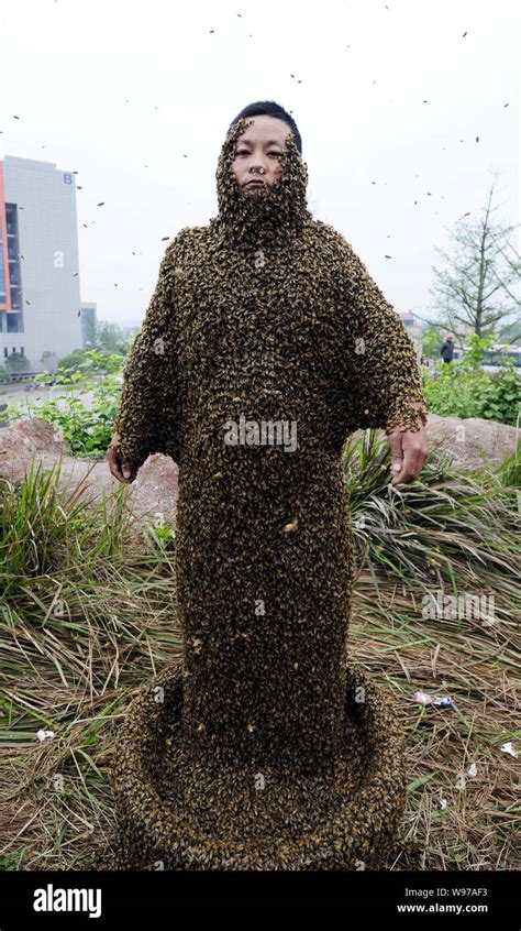 Chinese Beekeeper She Ping Whose Body Is Covered By Bees Poses During A Challenge For Breaking A
