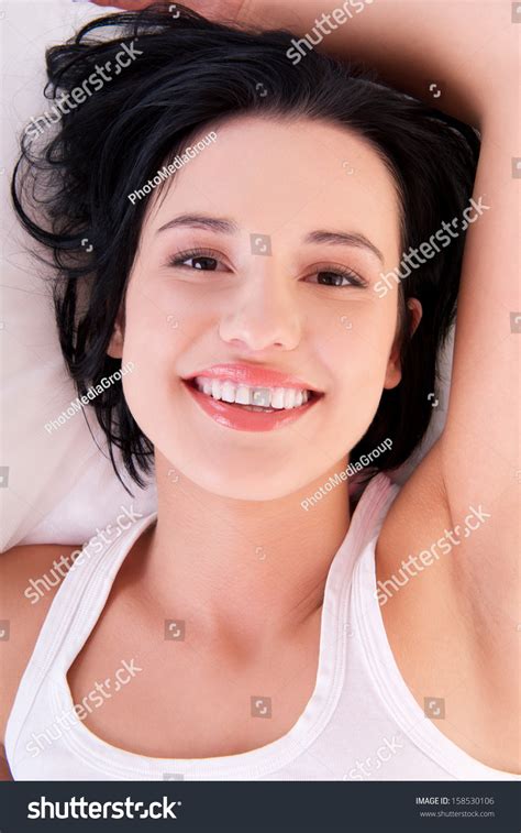 Стоковая фотография 158530106 Happy Sensual Young Woman Lying Bed