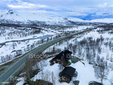 Aerial View Of Traditional Norwegian Cabin In Snow Reinheimen National