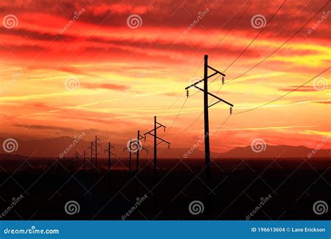 Telephone Power Poles In Countryside Sunset Or Sunrise Stock Photo