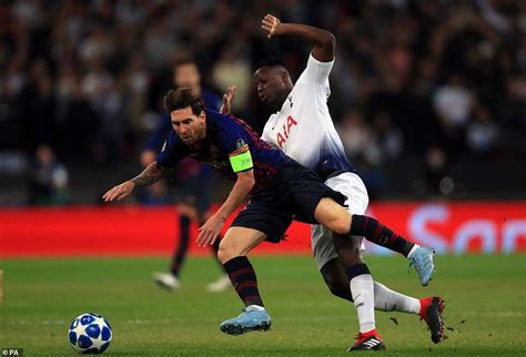 messi goes down under a heavy challenge from spurs victor wanyama after embarking on a windy