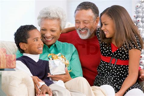 An African American Grandparents With Their Grandchildren Celebrating