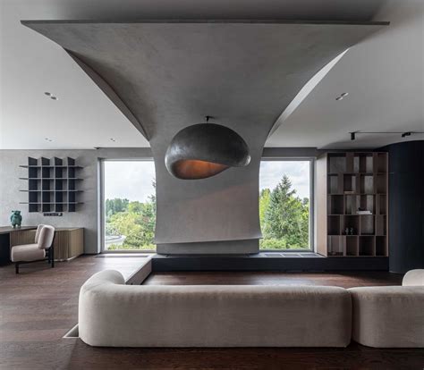 A Curved Accent Wall Wraps Around From The Fireplace To The Ceiling