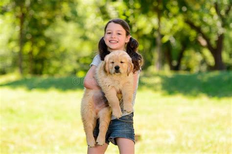 Portrait Of Girl Holding Puppy Stock Photo Image Of Father Mammal