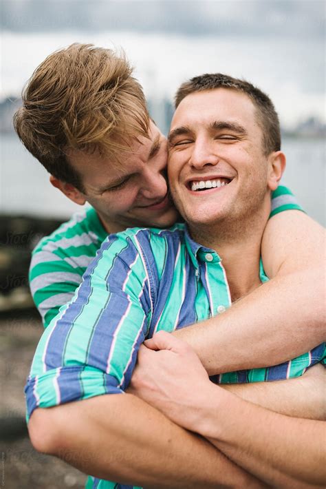 Happy Gay Couple Hugging Outdoors By Stocksy Contributor Simone Wave