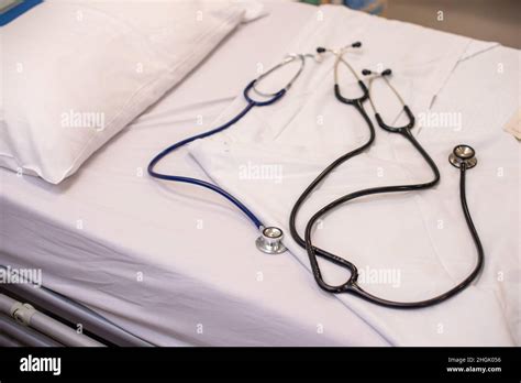 Doctors stethoscopes sat on a hospital bed Stock Photo - Alamy