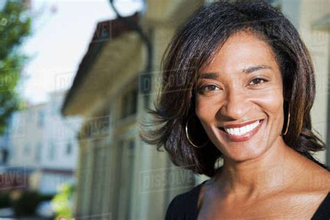 Close Up Of African Woman Smiling Stock Photo Dissolve