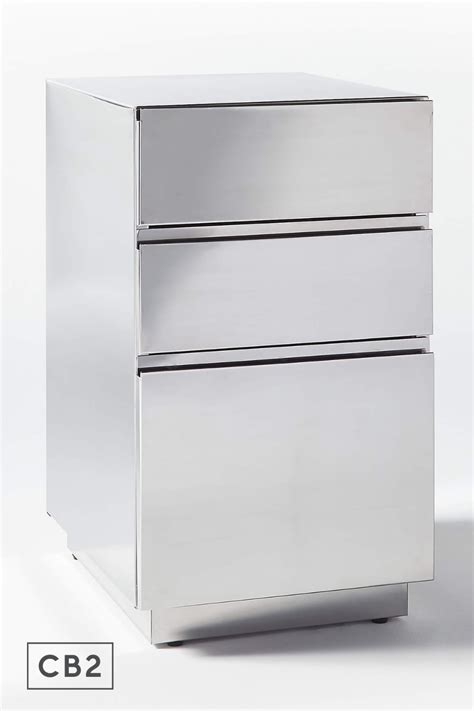 Clean Lined Cabinet Rises In Stainless Steel As Simple Storage