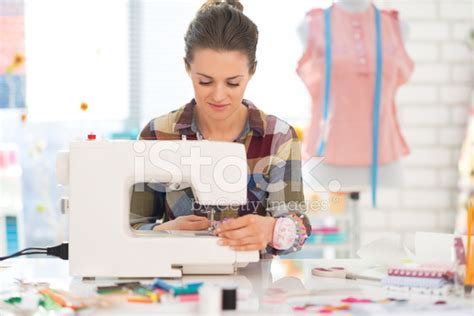 Seamstress Sewing In Studio Stock Photo Royalty Free Freeimages