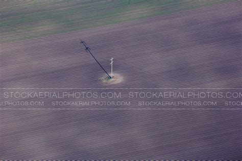 Aerial Photo Power Lines Through Field