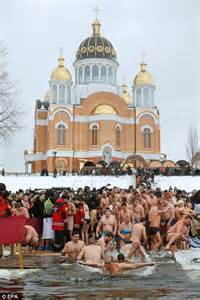 Orthodox Christians Bathe In Icy Waters To Mark Epiphany Daily Mail Online