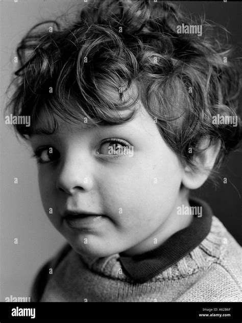Head And Shoulder Portrait Of Child With Inquissative Expression Stock