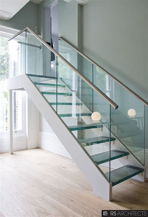 picturesque double chrome handrail with glass balustrade and landing glass stairs in modern open