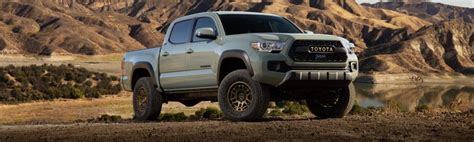Front Side View Of 2022 Toyota Tacoma Trail Lunar Rock Parked In Front