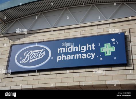 Boots Midnight Pharmacy signage Stock Photo - Alamy