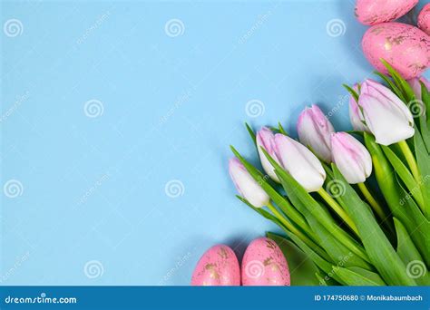 Bouquet Of White Tulip Spring Flowers And Pink Easter Eggs In Corner Of