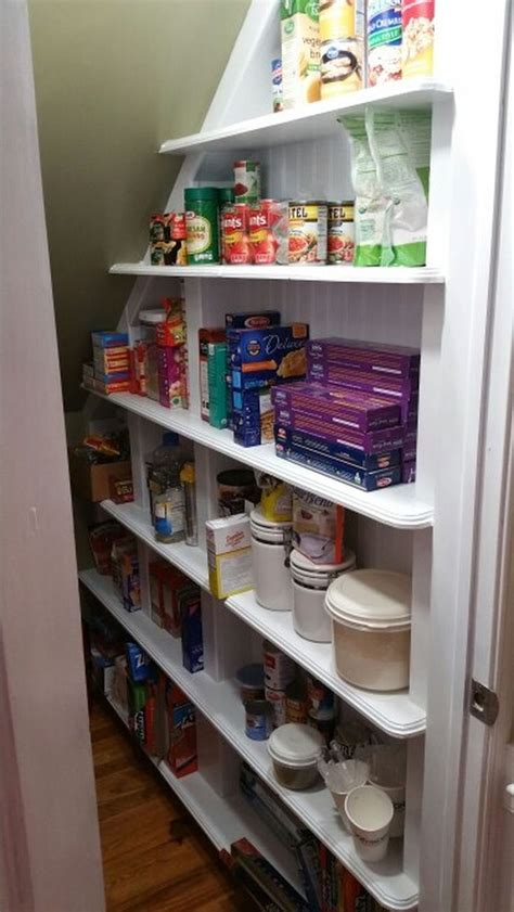 Storage pantries slide out from under the stairs to show off shelves that can house most any sized food items. Awesome Cool Ideas To Make Storage Under Stairs 91 ...