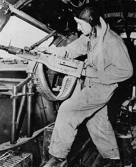 Waist Gunner Readying His M2 Browning Machine Gun Aboard Boeing B 17