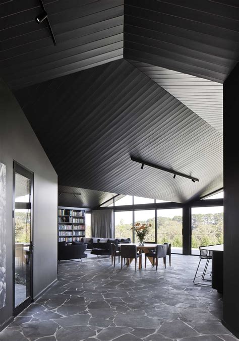 Pitched Roofs Cover This Dark And Moody Farmhouse
