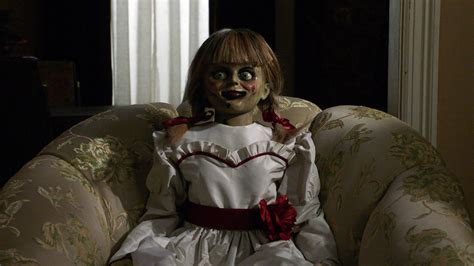Download Annabelle Doll On Sofa Wallpaper