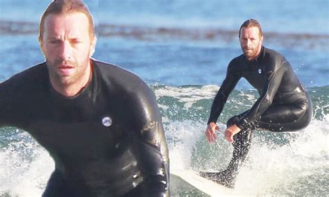 Chris Martin Wears Long Black Wetsuit For Solo Surf Session In Malibu