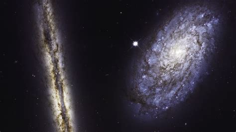 Nasas Hubble Telescope Captured Two Galaxies In One Epic Photo — Quartz