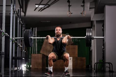 Athlete Lifting Barbell Silhouette Of A Muscular Man Stock Photo