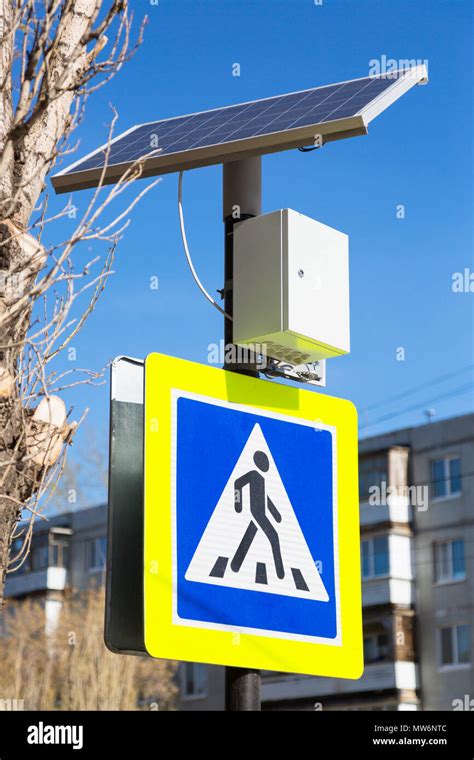 At The Pedestrian Crossing A Modern Traffic Light Is Installed Which