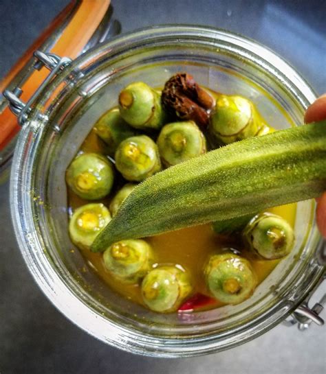 Pickled okra is a southern summer treat and a quick and easy way to preserve your extra harvest. Pickled Okra Recipe - ThinkEatDrink