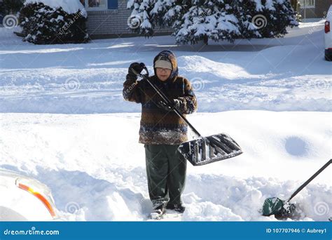 Lady Shoveling Snow Stock Photo Image Of Covering Thick 107707946