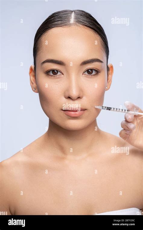 Asian Pretty Woman Is Getting An Injection Stock Photo Alamy