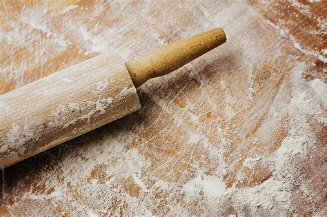 Rolling Pin And Flour On A Wooden Board Close Up By Stocksy