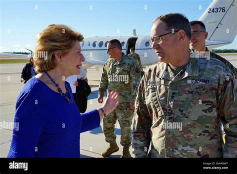 Michigan Senator Deborah Stabenow Is Greeted By Us Army Maj Gen