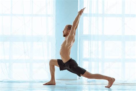 Man Practicing Advanced Yoga A Series Of Yoga Poses Lifestyle Concept