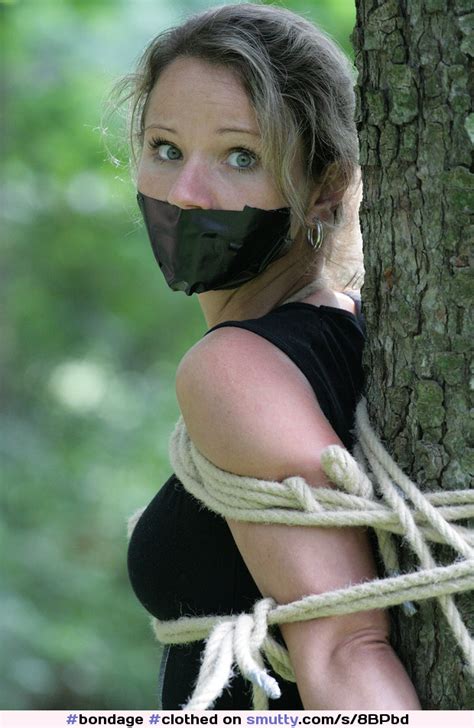 Clothed Blonde With Prettyface Tied With Rope To A Tree Blondage