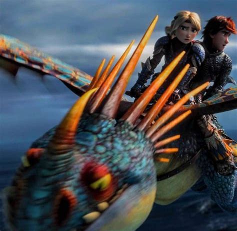Two People Riding On The Back Of A Dragon