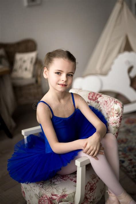 Cute Little Ballerina In Blue Ballet Costume And Pointe Shoes Stock