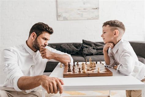 Dad And Son Playing Chess Together Stock Image Image Of Home Handsome 187532449