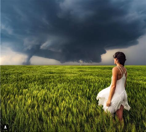 An Eyeful Of The Storm Brave Woman Poses In Front Of Tornado For