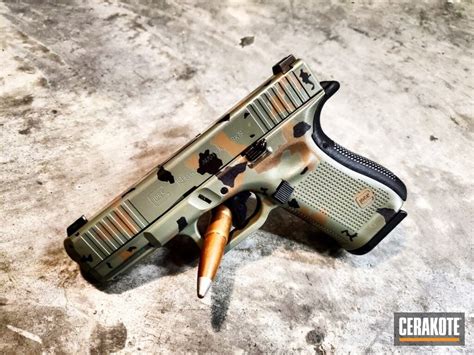 Glock 19 Handgun With Custom Cerakote Elite Woodland Camo Finish By