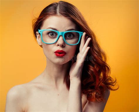 Attractive Woman Naked Shoulders Red Lips Blue Glasses Studio Stock