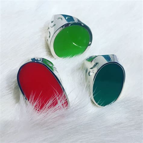 Sterling Silver Hand Made Rings With Neon Colors On Display At