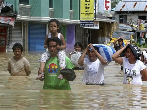 Philippine Typhoons Kill 59 Floods Trap Hundreds