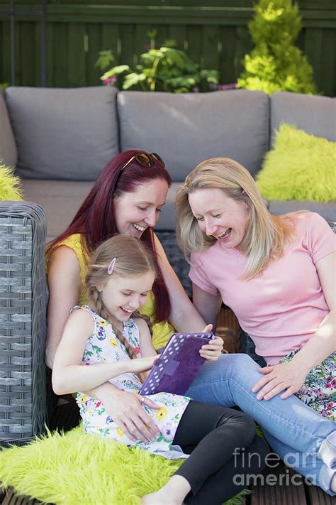 Lesbian Couple And Daughter Using Digital Tablet Photograph By Caia Imagescience Photo Library