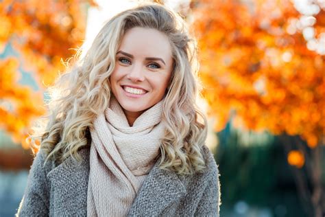Beautiful Smiling Blond Woman With Curly Hair And Blue Eyes Ok Dental