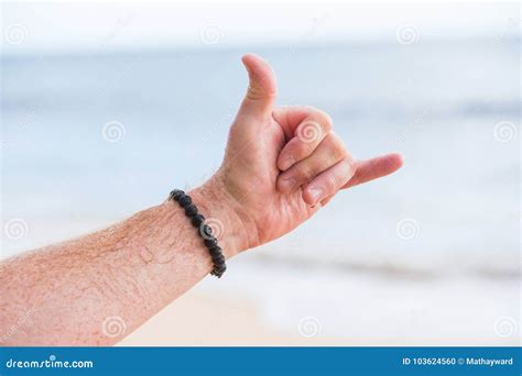 Hand Showing The Hang Loose Sign At A Beach Stock Photo Image Of Sign
