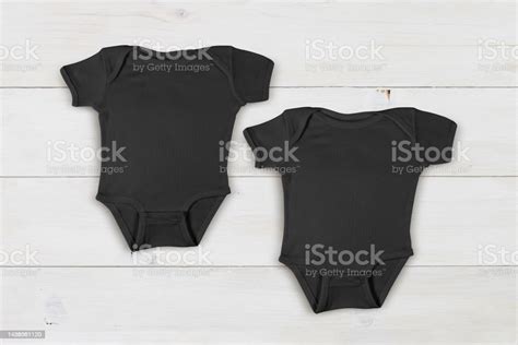 Two Black Baby Onesies Mockup On Contemporary White Wood Background