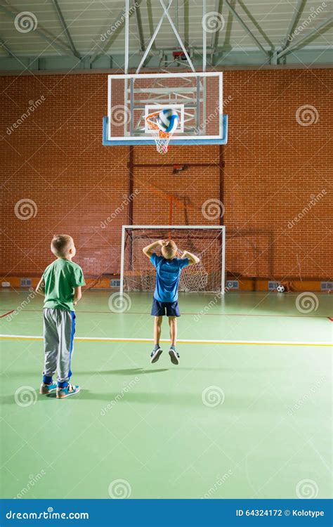 Two Young Boys Practicing Their Basketball Stock Photo Image Of Hoop