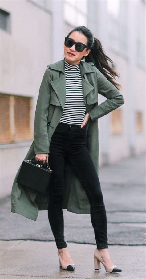 olive green trench coat black and white striped top and black skinny jeans green coat outfit